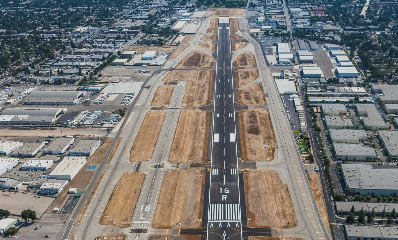Aerial view of airport runways and hangars